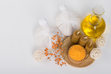 items for taking spa treatments and relaxation, bags and massage oil, aroma candles, bath salts, top view, there is a place for an inscription