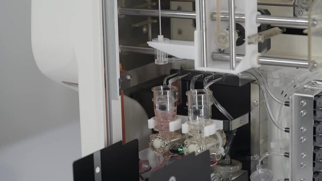 Close up gimbal shot from inside Blood CBC machine working