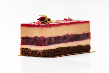 Cherry biscuit cake with soufflé on white plate