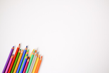 Colored pencils on a white background. Place for your text. Copy space. Mockup