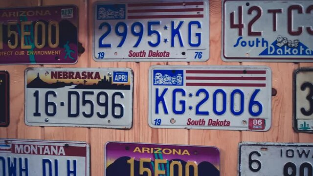 KEYSTONE, SD - JULY 2019: Car plates attached to a restaurant wall