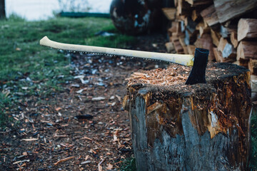 axe in the stump chopping wood