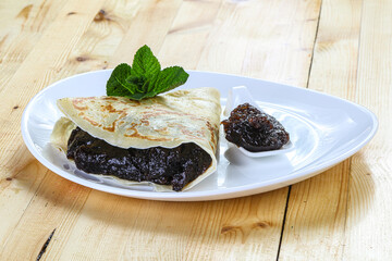 Delicous pancake with fruit jam