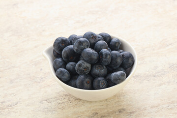 Sweet ripe blueberry heap in the bowl