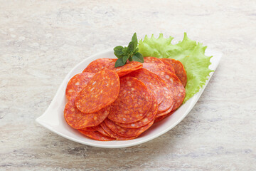 Sliced pepperoni sausage in the bowl