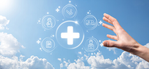 Businessman hold virtual plus medical network connection icons. Covid-19 pandemic develop people awareness and spread attention on their healthcare.Doctor,document,medicine,ambulance,patient icon.