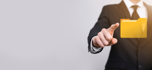 Businessman hold folder icon.Document Management System or DMS setup by IT consultant with modern...