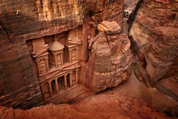 Treasury Al-Khazneh, stone rock historic sight in Petra. Travel Jordan, Arabia holiday. Evening...
