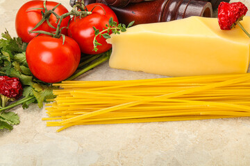Raw Italian spaghetti heap with cheese