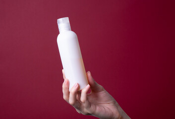 packaging of lotion or hand cream in female hands