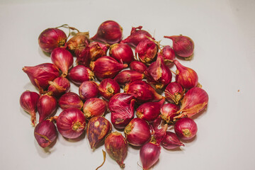 whole bunch of shallots isolated on white background.

