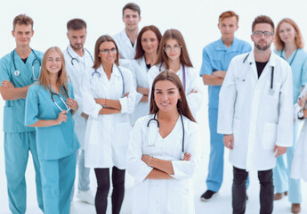 large group of medical professionals applauding their leader