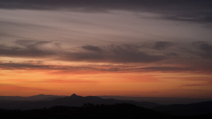 Soft pastel colours in post sunset sky over valleys and rolling hills of Valenciana region Spain