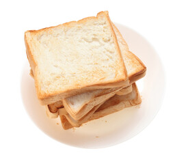 Slices toast bread in dish on white background