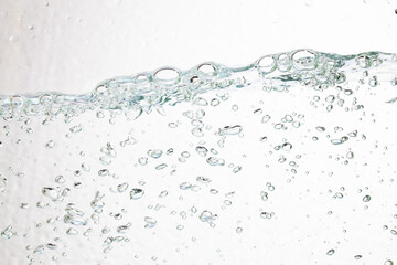 Closeup bubbles underwater on white background.