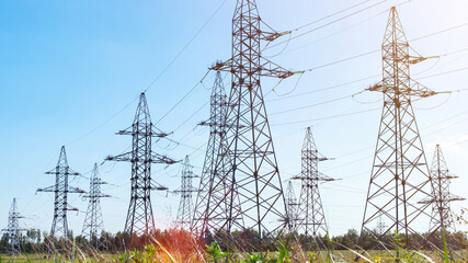 Transmission pylons with high-voltage power lines with copy space. Transmission towers in...