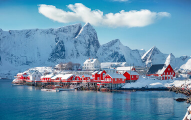 Attractive morning scene of Sakrisoy village, Norway, Europe. Bright winter view of Lofoten Islads witj typical red wooden houses. Beautiful seascape of Norwegian sea. Traveling concept background. - obrazy, fototapety, plakaty