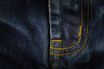 Closeup sewing line of vintage blue jeans