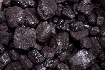 Photograph shot from an overhead point of view of some carbon rocks.Photo taken in studio with artificial light and in horizontal format.