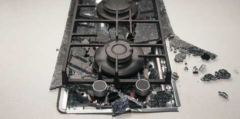 The glass-ceramic hob from the stove in the kitchen cracked from the explosion to shards