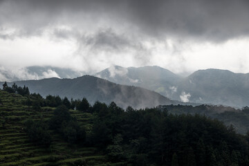 High Mountains with dark clouds, bad weather