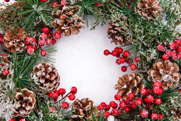 Frame christmas advent wreath with viburnum on the snow with white middle