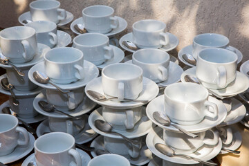 set of white cups for coffee and tea