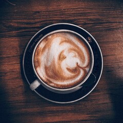 cup of coffee on wooden table