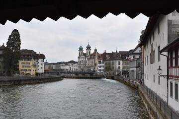 Jesuit church and other historic buildings on the banks of river Reuss in Luzern. View from the...