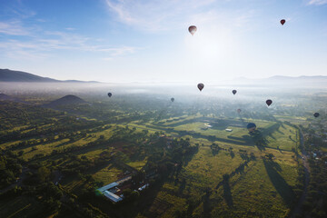 Hot Air Balloon Flight over Teotihuacan at sunrise in  Mexico. View from the top.