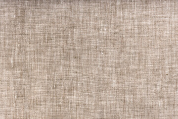 textile background from natural linen fabric close up