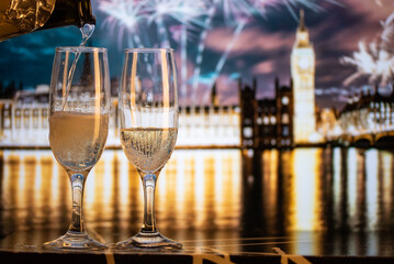 champagne glasses and Big Ben in background New Year's eve in London