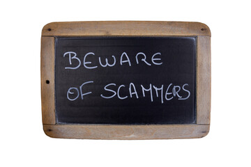 Fototapeta premium blackboard with text Beware of scammers and wooden frame, isolated on white background