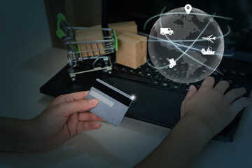 Transportation and intelligent global logistics network, female hand holding a credit card. Digital composite image. - Powered by Adobe