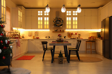 Cozy dining room decorated for Christmas. Interior design
