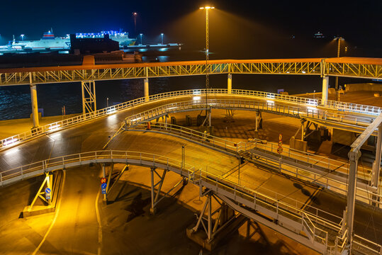 Ferry terminal and linkspan to the ro-ro ship in the harbor of Ystad at night. The ferry connects the city of Świnoujście in Poland and Ystad in Sweden