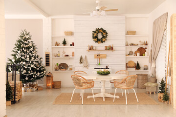 Cozy dining room interior with Christmas tree and festive decor