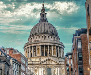 Naklejka premium London, United Kingdom - January 2013: St. Paul's Cathedral under dramatic clouds. The cathedral is one of the most famous and most recognizable sights of London