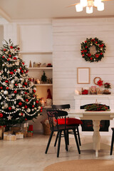 Cozy dining room interior with Christmas tree and festive decor