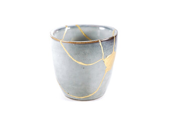 kintsugi gold cracks restoration, Japanese bowl fixed with the antique kintsukuroi restoration...