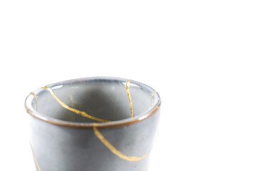 kintsugi gold cracks restoration, Japanese bowl fixed with the antique kintsukuroi restoration...