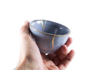 kintsugi gold cracks restoration, Japanese bowl fixed with the antique kintsukuroi restoration...
