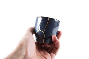 kintsugi gold cracks restoration, Japanese bowl fixed with the antique kintsukuroi restoration...