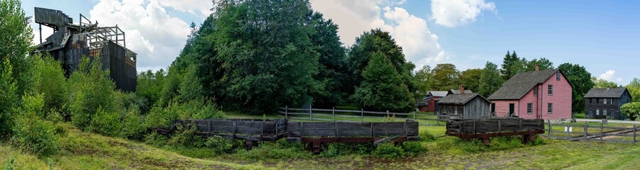 Fototapeta premium Historic Coal Breaker Rail Cars and Old Village