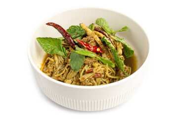 Spicy Bamboo Shoot Salad, a local food in northeastern Thailand, made from shredded bamboo shoot, herbs and many ingredients, isolated on white background. Clipping path