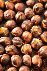 Hazelnuts roasted in an oven. Close up.