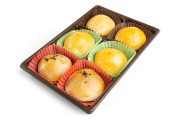 Homemade Chinese Cake, sweet dessert, stuffed with beans and egg yolks in a plastic box container, isolated on white background. Clipping path