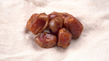 Dates in wooden bowl on background. dried dates fruit.