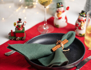 Merry Christmas table holiday serving with linen towels and kitchen ware.