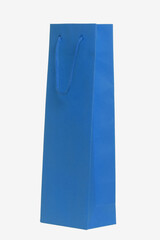 Closeup of a single blue paper bag or pouch with blue handle for shopping or for gifts isolated on a white background. Macro photograph.